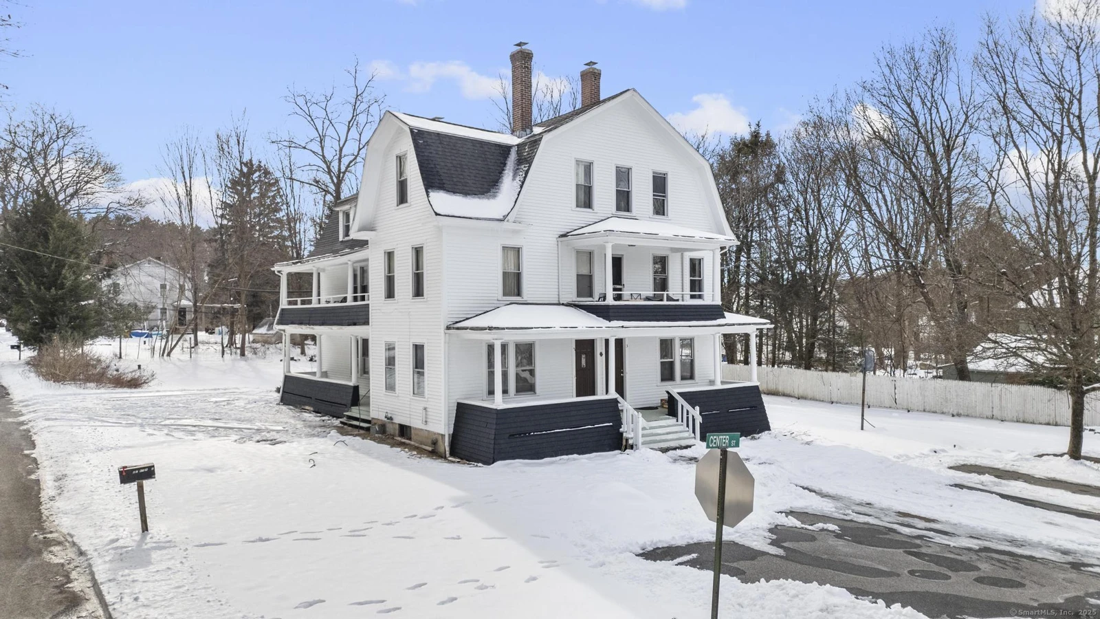 Cornerstone-owned white multifamily property with covered porches